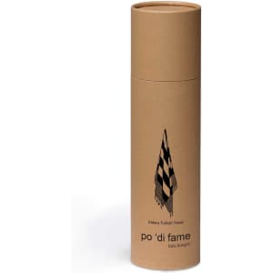 A cylindrical cardboard packaging for a Patara Turkish Towel featuring a checkered design and a branded logo.