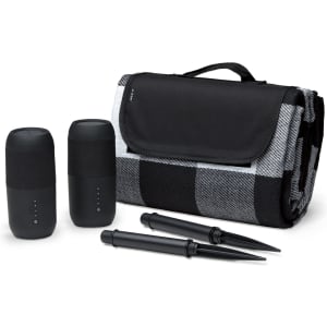 A black and grey checked blanket set, featuring two black speakers and two black stakes.
