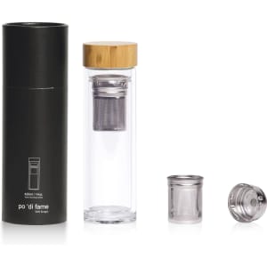 A drink bottle made of clear glass with a bamboo lid and stainless steel infuser, presented alongside its packaging.
