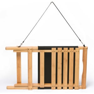 A wooden beach chair with a black canvas seat, featuring a hanging strap for easy transport.