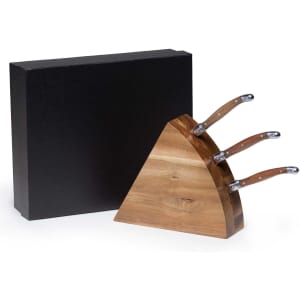 A wooden wedge-shaped cheese knife block set with three stainless steel knives, presented in a black box.