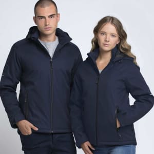 A man and woman wear navy soft shell jackets with hoods, each featuring zippers and pockets. The jackets have branding.