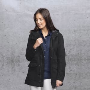 A woman models a black twill jacket featuring a hood, with pockets and a casual style.