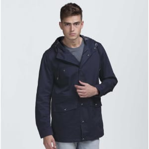 A navy blue jacket with a hood and multiple pockets, featuring a logo. Modelled by a young man.