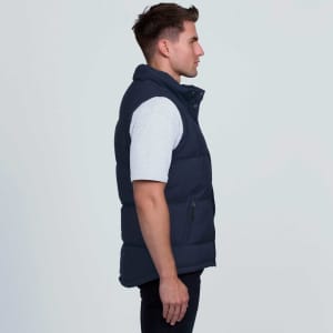 A navy smpli Junction Puffa Vest with a high collar and zip pockets, shown from the side.