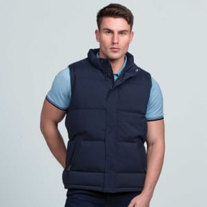 A navy puffa vest with a high collar and zippered pockets, featuring a branding logo. Suitable for layering.