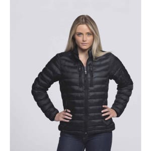 A woman wearing a black puffer jacket, featuring a zipped front and a sleek design, stands against a neutral background.