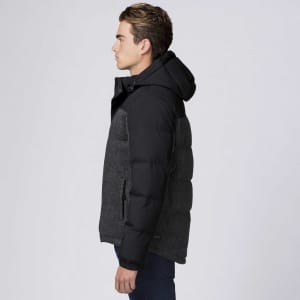 A side view of a black and grey rain jacket featuring a hood and a logo on the sleeve.