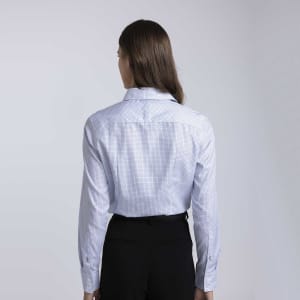 A women's button-up check shirt in light blue with long sleeves and a fitted style, featuring a logo.
