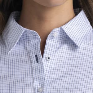 A close-up of a women's button-up shirt featuring a blue and white check pattern, with a collar and buttons.