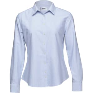 A light blue button-up shirt for women with long sleeves and a collar, featuring a logo.