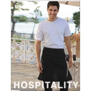 A man wearing a black cotton drill half apron with a pocket outdoors, smiling in casual attire.