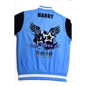 A blue sports jumper with black sleeves featuring a graphic design and a logo.