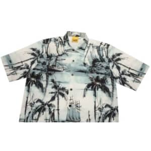 A short-sleeved shirt featuring a blue and white tropical print with palm trees and sailing ships. It has a collar and buttons.