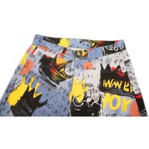 A pair of shorts with a colourful graphic print featuring various designs in blue, yellow, black, and red.