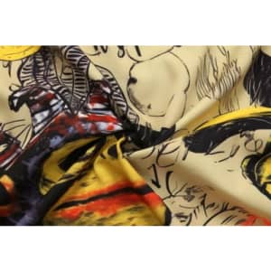 A vibrant fabric featuring a blend of yellow, red, and black patterns, designed for varsity jacket lining.