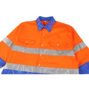 A vibrant orange Hawaiian shirt with reflective silver stripes and a blue patterned collar, featuring a logo.