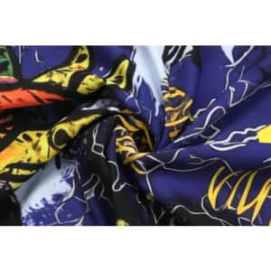 A vibrant purple and multi-coloured fabric featuring bold patterns, designed for sports uniforms with a sublimation lining.