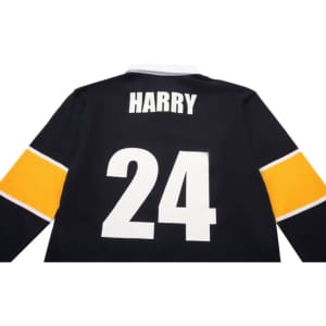 A black sports jumper featuring a white and gold collar, with the name "HARRY" and the number "24" on the back.