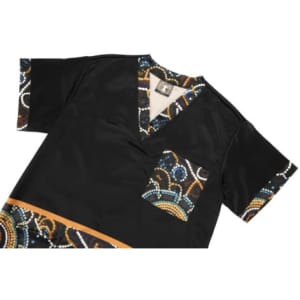 A black Hawaiian shirt featuring colourful patterned sleeves and a pocket, showcasing a vibrant design.
