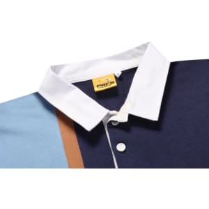 A sports jumper featuring a navy blue body, light blue sleeves, and a white collar, with a branding label.