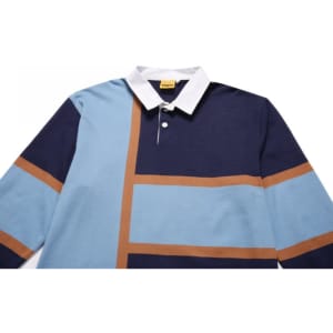 A sports jumper featuring navy, light blue, and brown colours, with a white collar and a logo.