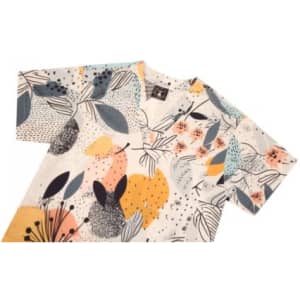 A Hawaiian shirt featuring a floral design in yellow, orange, blue, and white, with short sleeves and a logo.