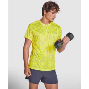 A bright yellow Assen T-Shirt made from a lightweight material, worn by a man holding a dumbbell.