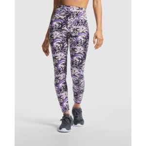 Purple and white marbled leggings with a high waist design, featuring a logo on the waistband.