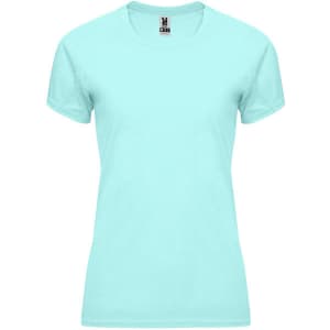 A light blue women's t-shirt with a round neckline and short sleeves, featuring a logo at the collar.