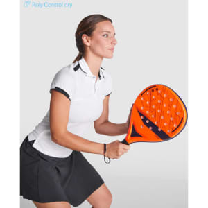A white polo shirt with black accents worn by a woman preparing to hit a paddle racquet.