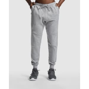 Grey track pants with a drawstring waist and elastic cuffs, featuring a logo on the side.