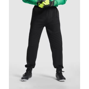 Black Bayern goalkeeper trousers with a quilted design and elastic waistband, paired with gloves and shoes.