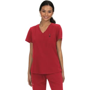 A red medical top with a v-neck design, featuring a pocket and a logo. A model wears the top confidently.