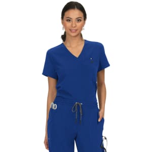 A blue scrubs top featuring a v-neck design and a logo, styled with a drawstring waist.