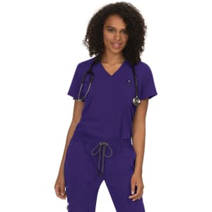 A woman wears a purple v-neck top with a stethoscope around her neck, featuring a logo.