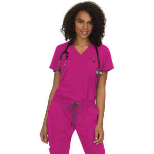 A model wearing a vibrant pink scrub top, accompanied by a stethoscope, with matching pink pants.