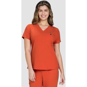 An orange V-neck top worn by a smiling woman, featuring a small logo on the chest.