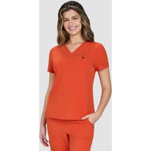 An orange V-neck top with short sleeves, featuring a logo, modelled by a smiling woman.