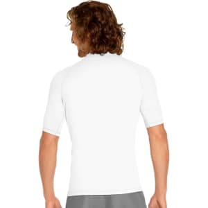 A back view of a short sleeve rashie in white, featuring a fitted design and a logo on the back.