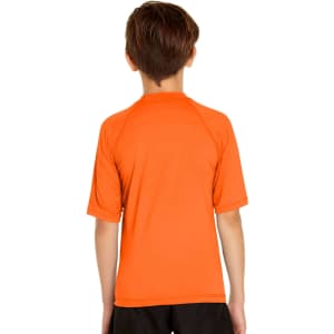 An orange short sleeve rashie designed for youth, featuring a smooth, lightweight fabric and a simple back design.