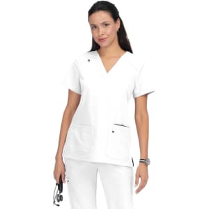 A woman in a white medical top with two front pockets, wearing white pants and holding a stethoscope.