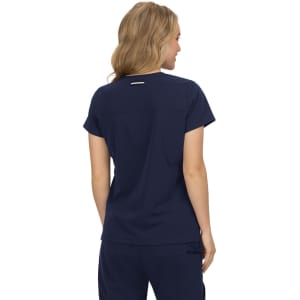 A navy blue top with a short sleeve design, featuring a subtle logo on the back.