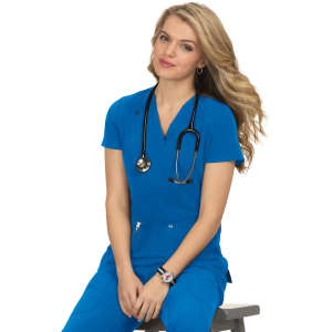 A woman in a bright blue top and scrubs, seated with a stethoscope around her neck, smiling.