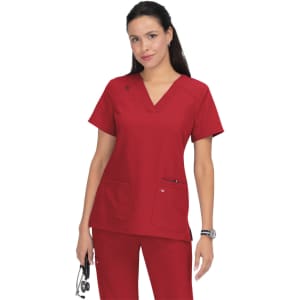 A red scrub top with a V-neck, featuring two front pockets and a logo on the chest.