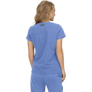 A blue top featuring a simple design and a logo on the back. The model is shown from behind.