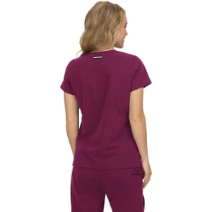 A top in a rich burgundy colour, featuring short sleeves and a back logo detail.