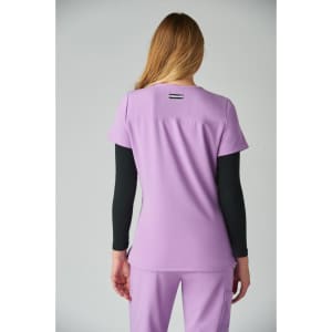 A purple top featuring short sleeves and a black long-sleeve underlayer. It includes a logo on the back.