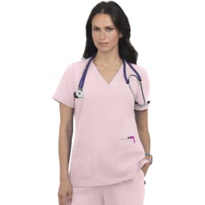 A pink medical top with a V-neck and two front pockets, worn by a model with a stethoscope around her neck.