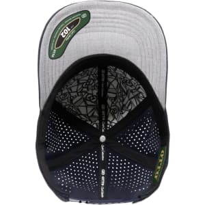 A grey and black perforated cap with a structured 6-panel design and an interior patterned lining. It features a logo.